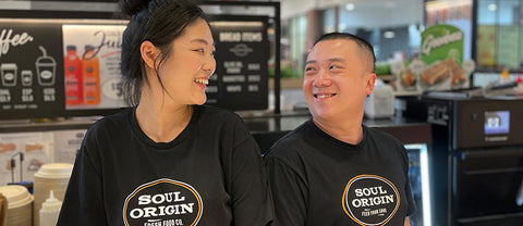 Two people smiling at each other